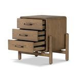 Close-up of black metal and oak wood drawer handle in modern design
