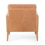 Rear view emphasizing panel stitching and uniform butterscotch leather upholstery