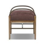 Front view highlighting arched bronze arms and wooden frame detail beneath cushion