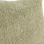 Close-up of boucle texture highlighting woven loops in sage green fabric