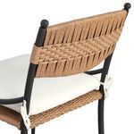 Backrest close-up showing woven pattern details and rounded black finish frame tops