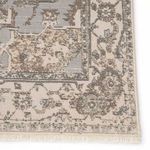 Close-up of corner showing detailed border pattern and fringe on the Alain Medallion Gray Cream Rug