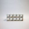Opposite front view showing similar cubed bone texture and pattern alignment