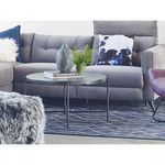 Alternate living room scene with Petro Coffee Table on patterned dark rug with sofa cushions