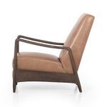 Close-up of olive green leather upholstery on seat and armrest