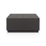 Narrow edge view showing slats on the top surface of the coffee table