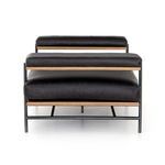 Back angled view showcasing toasted oak strip between leather cushions and metal legs