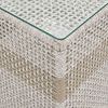 Close-up of corner detail where woven rope meets tempered glass surface on side table