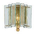 Duvernell Wall Sconce backplate and arm in gold leaf finish seen behind textured glass panes