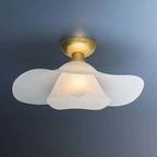 Netherlee Flush Mount ceiling light with two shallow frosted glass shades forming a flowing floral silhouette and aged bra...