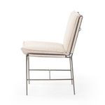 Side profile of Ventura Irving Taupe Dining Chair emphasizing slim iron frame and padded seat