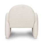 Rear view showing plain fabric on the back panel and the thickness of the armrests