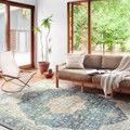 Skye Ocean Multi Rug in bright living room setting with modern furniture and large windows