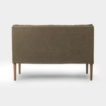 Rear view displaying smooth upholstery cover and four solid oak legs