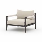 Side view focusing on armrest wrapping detail and plush back cushion