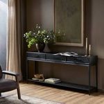 Rosenell Console Table in black-finished oak placed against taupe wall with decor