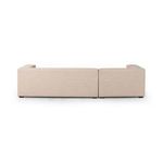 Rear view of sectional showcasing clean back upholstery and low wooden feet