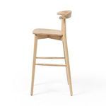 Side angle showing tapered legs and minimalist design of the Pruitt Stool