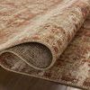 Close-up of Heritage Brick Multi rug rolled to show plush variable-pile texture and weave