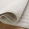 Close-up of Kamala rug folded to reveal plush texture and woven backing