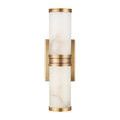 Front view of sconce highlighting lighter alabaster color variation beneath brass rings