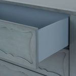 Interior view of open drawer in Sara Cabinet showing clean lined blue-painted wood inside