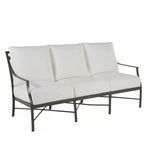 Monaco Slate Gray Aluminum Sofa with slender arms, signature X-frame back design, and white cushions.