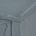 Top corner detail of Sara Cabinet showing raised edge molding and subtle wood grain finish
