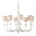 Chandelier with all eight patterned fabric lampshades glowing warmly, hanging by a linked chain