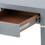 Open drawer detail showing wood interior and metal sliding mechanism inside Claudette Desk