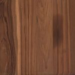 Detailed close-up of teak wood grain texture on thick rounded base