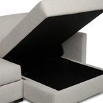 Detailed storage compartment with open lid exposing deep interior beneath chaise