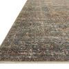 Low angle close-up showing rug’s pile texture and detailed border design