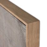Close-up of light natural wood frame corner with visible wood grain on Ryder painting
