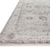 Low angle side view of Bonney Stone charcoal rug showing thin pile and border design detail
