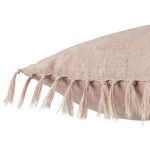 Close-up side view showing fabric texture and knotted tassels on blush pink linen pillow