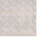Zoomed-in section highlighting low pile texture and muted earth tones in rug pattern