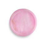 Round tray with soft pink alabaster stone featuring smooth polished surface and natural veining