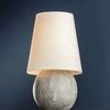 Ulsterville table lamp shown from a slight angle on white surface against blue background