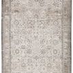 Odel Oriental rug with vintage-inspired floral lattice motifs in gray, cream, and silver hues, detailed edges