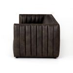Side profile from right of sofa showing the vertically channeled armrest and seat