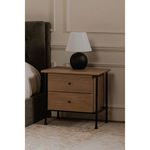 Tuve table lamp on small wooden nightstand with black metal legs beside dark upholstered sofa