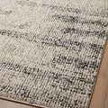 Close-up angled view highlighting ribbed texture and charcoal pattern details on Darby rug