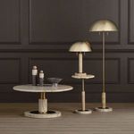 Lubo Breccia bowl styled on low marble and brass table with two dome brass lamps against wood paneled wall