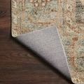 Corner fold back revealing woven underside with natural backing of Margot Ocean Spice rug