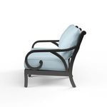 Side view showing curved armrest detail and plush light blue cushions on Monterey Loveseat