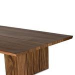 Close-up of corner showing clean edge joinery and continuous wood grain on table surface