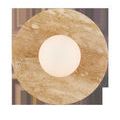 Top-down view of wall sconce focusing on round travertine disc and centered white glass globe