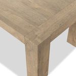 Close-up corner of table showing dovetail joinery on leg and top edge