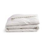 Folded ivory linen duvet and matching pillowcase with pinstripe pattern, isolated on white background
